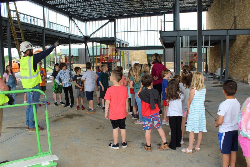 Photo of students touring inside the new school addition
